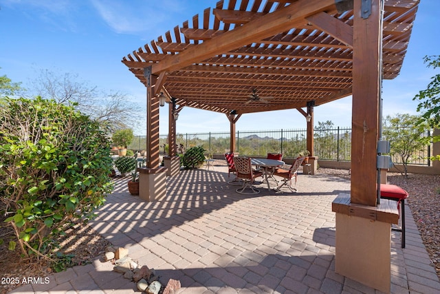 view of patio / terrace featuring a pergola, outdoor dining area, and fence