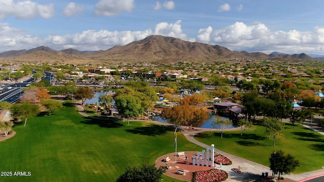 aerial view featuring a water and mountain view