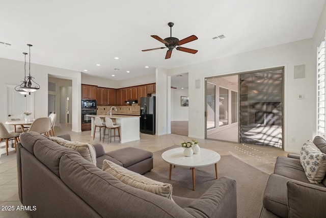 living area featuring a ceiling fan, light tile patterned floors, recessed lighting, and visible vents