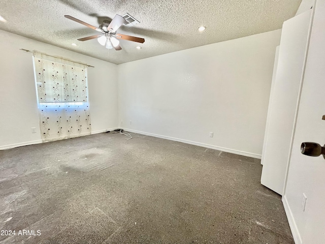 unfurnished room featuring ceiling fan and a textured ceiling