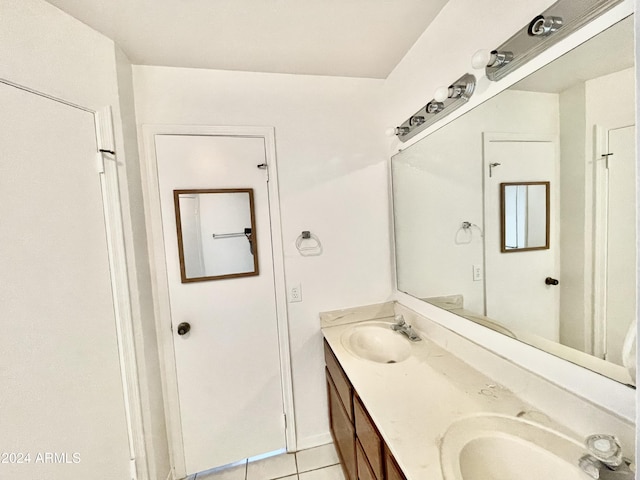 bathroom with tile patterned flooring and vanity