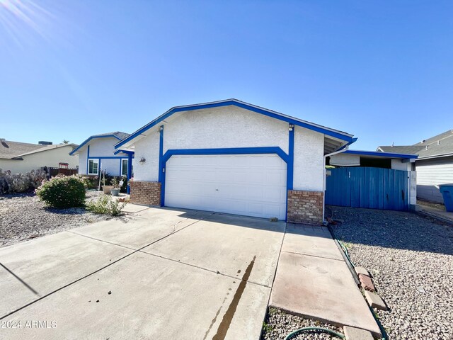 ranch-style home with a garage