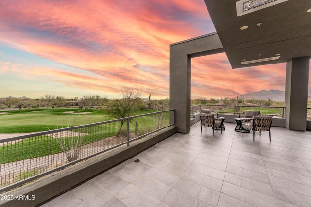 balcony with outdoor lounge area and view of golf course