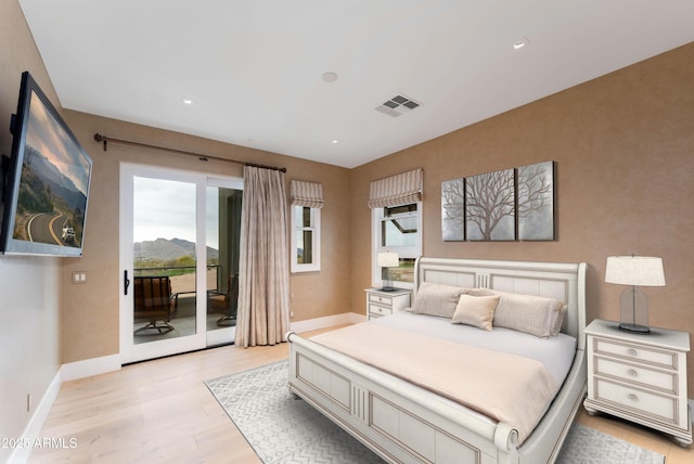 bedroom with visible vents, light wood-style flooring, recessed lighting, baseboards, and access to exterior