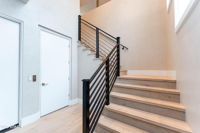 staircase with wood finished floors