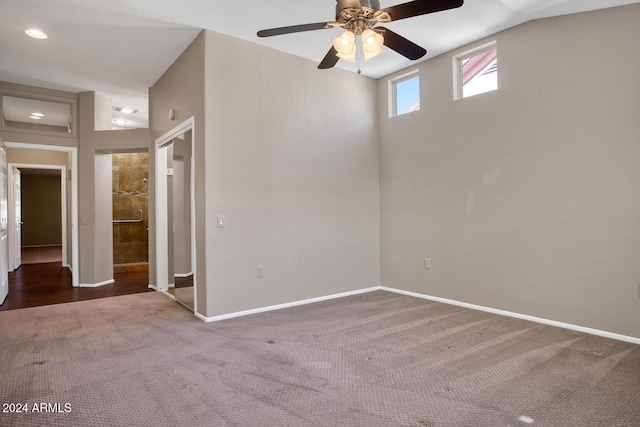 spare room featuring ceiling fan and carpet