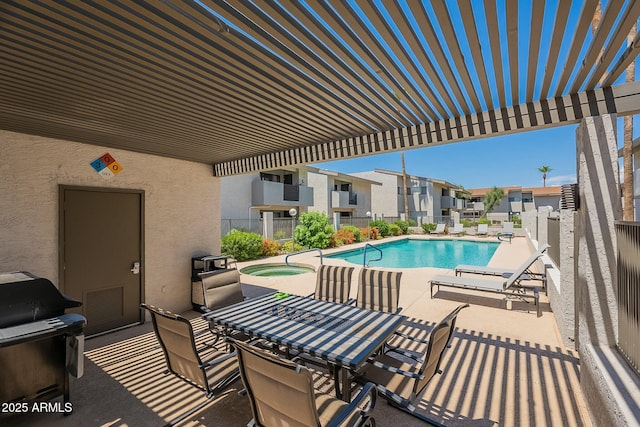 view of swimming pool featuring a community hot tub, a patio area, and a pergola