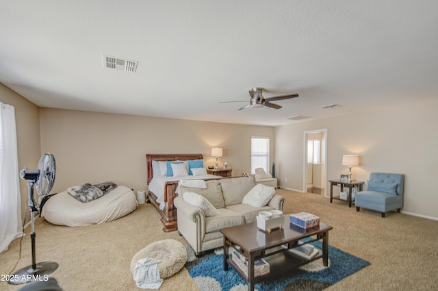 carpeted living room featuring ceiling fan, baseboards, and visible vents