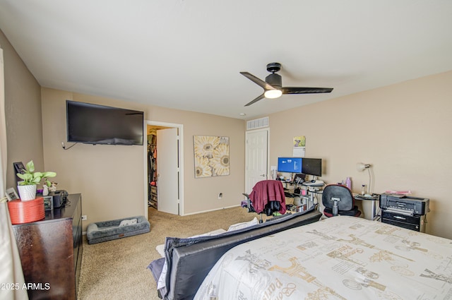 carpeted bedroom with ceiling fan, a closet, and visible vents