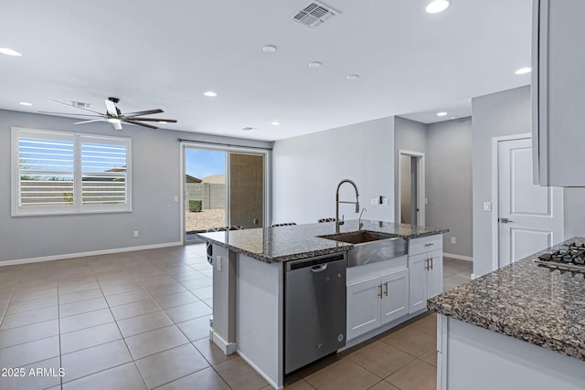 4628 W Greenleaf Dr, San Tan Valley, AZ 85144 - kitchen with stainless steel appliances, a sink, light tile patterned floors, plenty of natural light, and recessed lighting