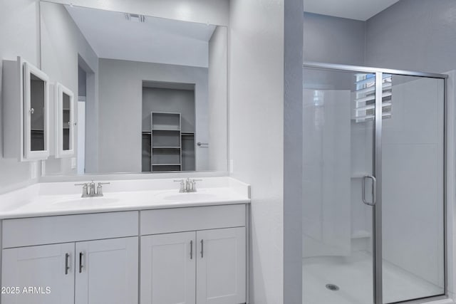 4628 W Greenleaf Dr, San Tan Valley, AZ 85144 - bathroom featuring a stall shower and double vanity