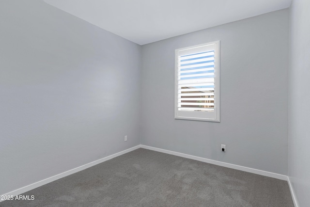 4628 W Greenleaf Dr, San Tan Valley, AZ 85144 - empty room featuring dark colored carpet and baseboards