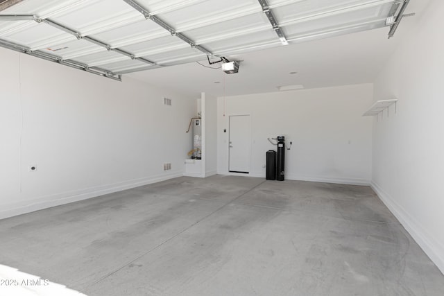 4628 W Greenleaf Dr, San Tan Valley, AZ 85144 - garage featuring water heater, a garage door opener, and baseboards