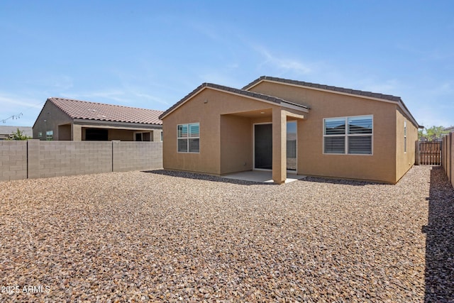 4628 W Greenleaf Dr, San Tan Valley, AZ 85144 - back of house featuring stucco siding, a fenced backyard, and a patio