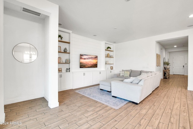 living room with light hardwood / wood-style flooring