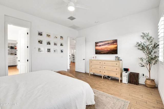 bedroom with wood-type flooring and ceiling fan