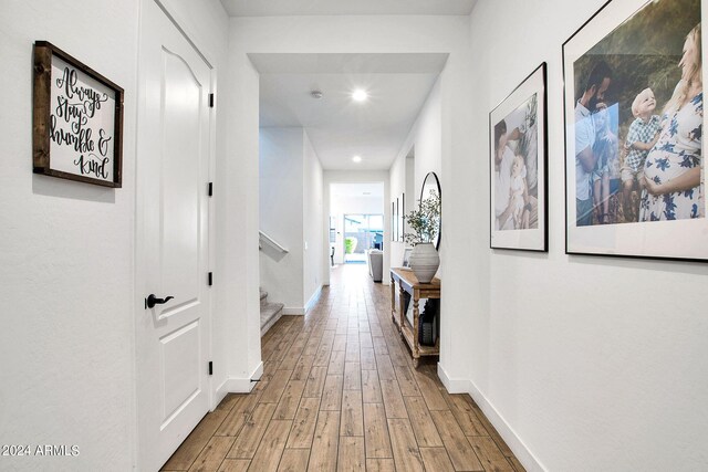 hallway with wood-type flooring