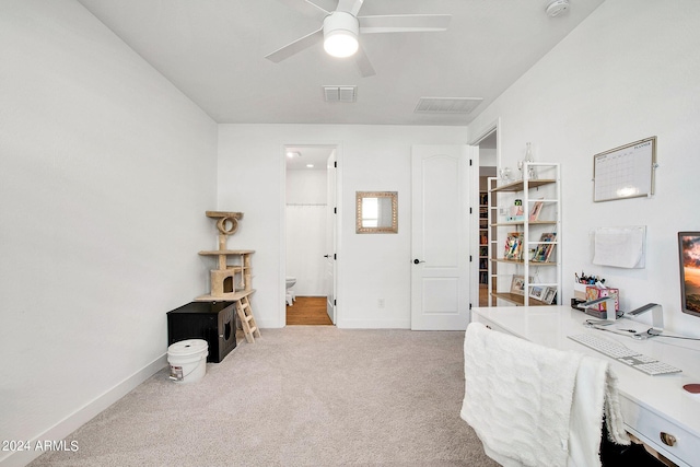 carpeted office with ceiling fan