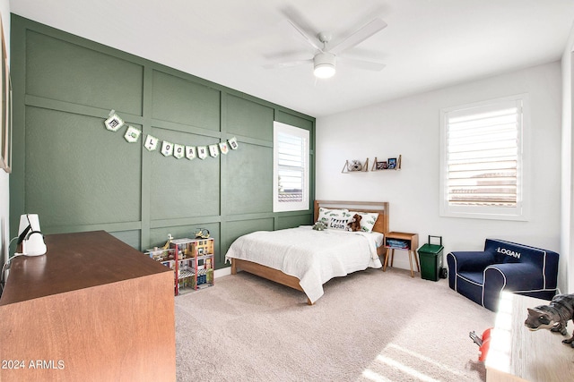 carpeted bedroom featuring ceiling fan