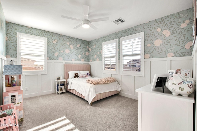 carpeted bedroom with ceiling fan