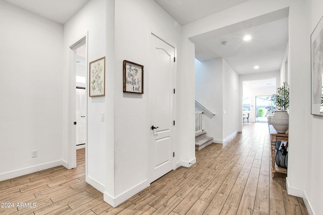 hall with light wood-type flooring