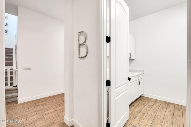 hallway with light wood-type flooring