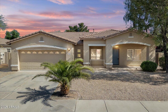 21192 E Stirrup St, Queen Creek, AZ 85142 - mediterranean / spanish home with stucco siding, a tiled roof, driveway, and a garage
