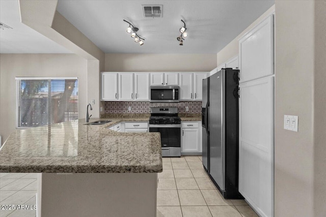 21192 E Stirrup St, Queen Creek, AZ 85142 - kitchen featuring white cabinets, a sink, stainless steel appliances, light tile patterned flooring, and a peninsula