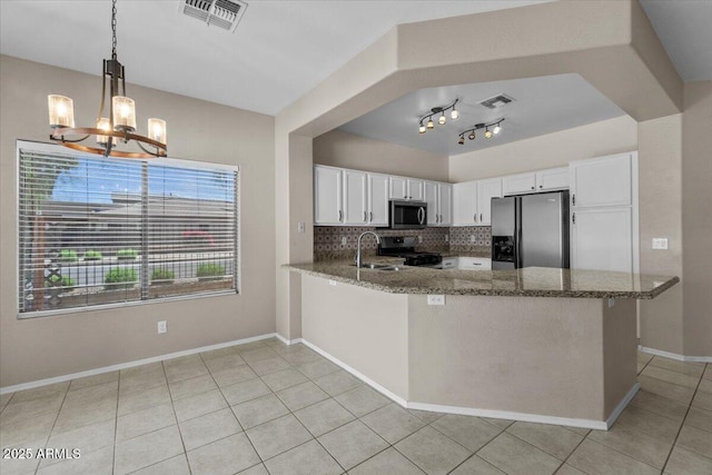 21192 E Stirrup St, Queen Creek, AZ 85142 - kitchen featuring a chandelier, stainless steel appliances, light tile patterned floors, stone counters, and visible vents