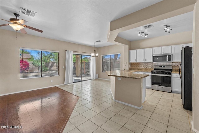 21192 E Stirrup St, Queen Creek, AZ 85142 - kitchen featuring a sink, visible vents, appliances with stainless steel finishes, and decorative backsplash