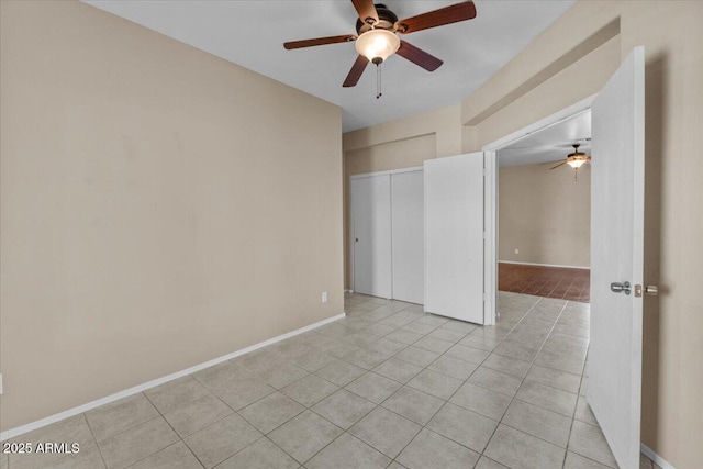 21192 E Stirrup St, Queen Creek, AZ 85142 - unfurnished room with light tile patterned floors, a ceiling fan, and baseboards