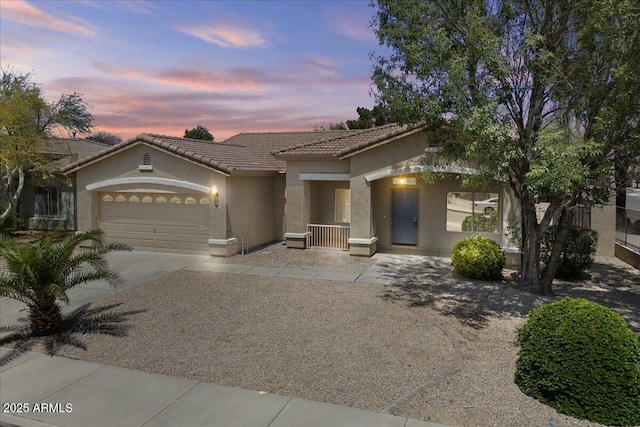 21192 E Stirrup St, Queen Creek, AZ 85142 - mediterranean / spanish-style home with stucco siding, a garage, concrete driveway, and a tile roof