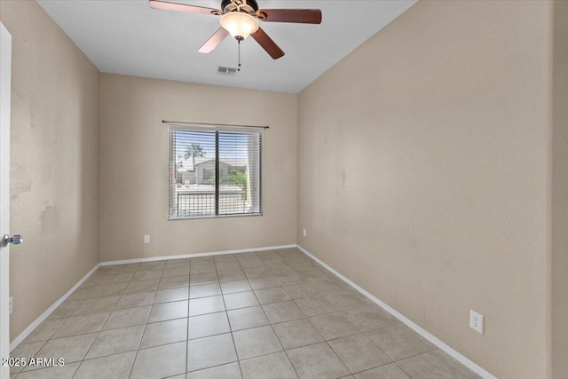 21192 E Stirrup St, Queen Creek, AZ 85142 - spare room with light tile patterned floors, ceiling fan, visible vents, and baseboards