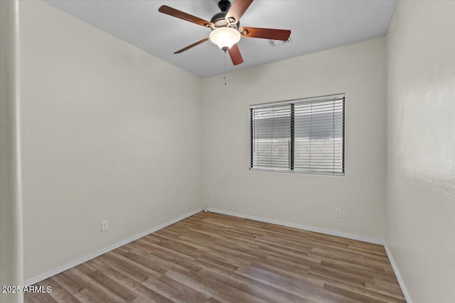 21192 E Stirrup St, Queen Creek, AZ 85142 - unfurnished room with a ceiling fan, visible vents, wood finished floors, and baseboards