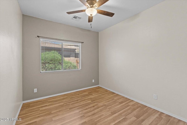 21192 E Stirrup St, Queen Creek, AZ 85142 - spare room with visible vents, light wood finished floors, and baseboards