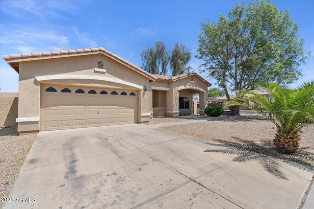 21192 E Stirrup St, Queen Creek, AZ 85142 - mediterranean / spanish home with stucco siding, driveway, a tile roof, and a garage