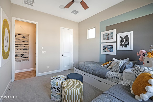 bedroom with light carpet and ceiling fan