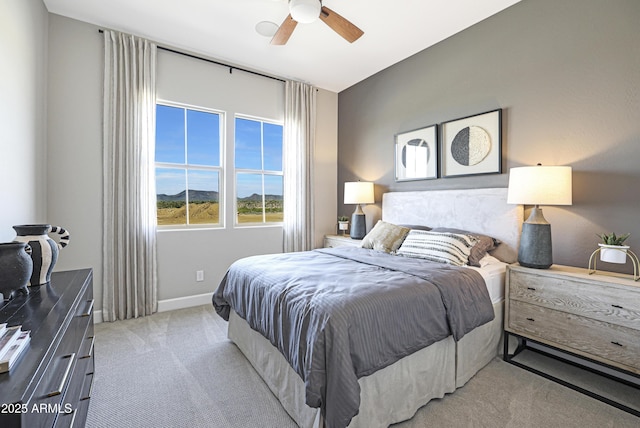 carpeted bedroom with ceiling fan