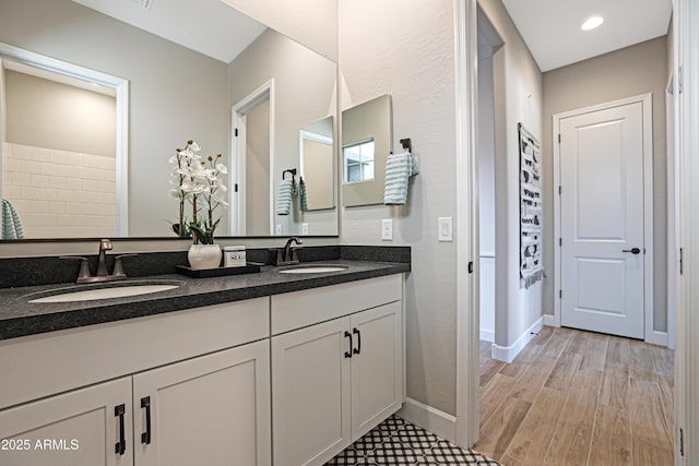 bathroom featuring vanity and hardwood / wood-style floors