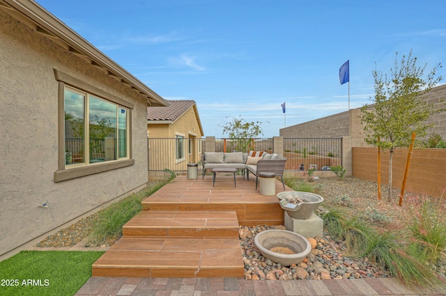 deck featuring outdoor lounge area