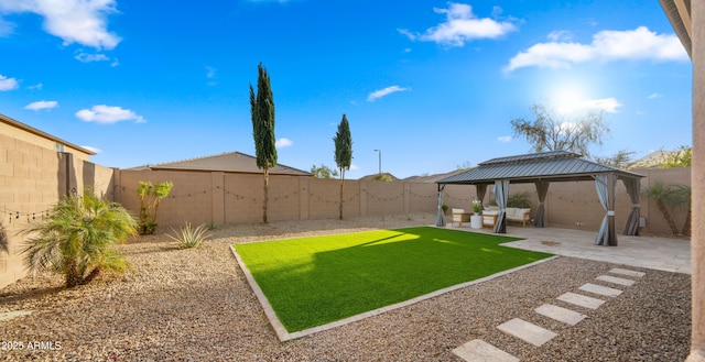 view of yard featuring a gazebo, a patio, and a fenced backyard