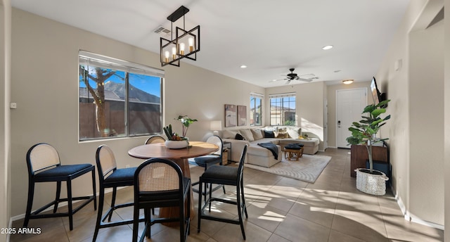 dining space featuring light tile patterned flooring, recessed lighting, visible vents, and baseboards