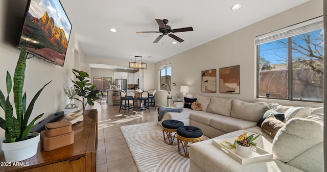 living area with recessed lighting, a ceiling fan, and light tile patterned flooring