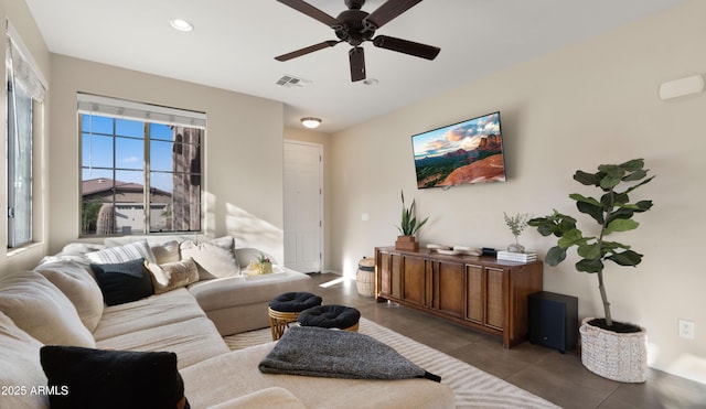 living room featuring a ceiling fan, recessed lighting, visible vents, and tile patterned floors