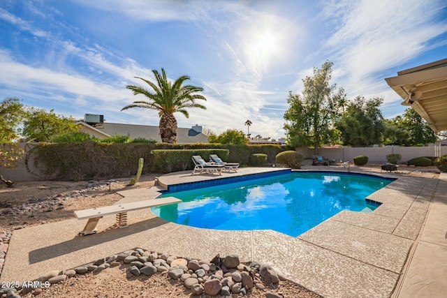 view of pool featuring a patio, a fenced backyard, and a fenced in pool