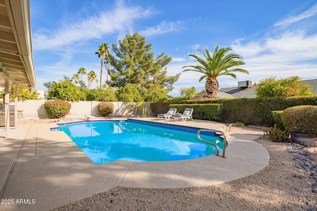 view of swimming pool with a patio, a fenced backyard, and a fenced in pool