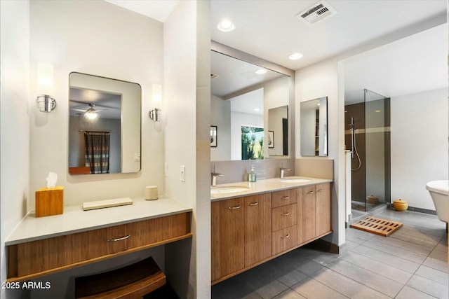 bathroom featuring ceiling fan, vanity, tile patterned flooring, and a shower