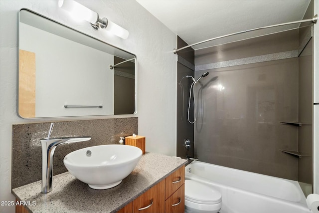 full bathroom with toilet, vanity, shower / washtub combination, and tasteful backsplash