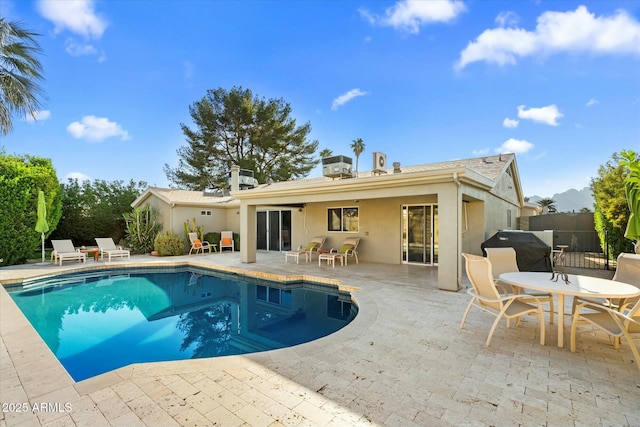 view of pool with a patio area and area for grilling