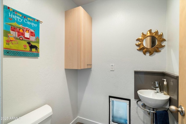 bathroom with toilet and sink